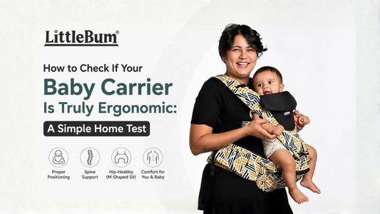 Baby sitting in ergonomic hip seat carrier with knees in M-position